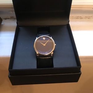 Blue face Movado with a black leather strap